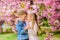 Tender love feelings. Couple kids on flowers of sakura tree background. Little girl enjoy spring flowers. Giving all