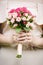 Tender rose bouquet flower in bride`s hands