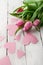 Tender spring tulips with pink paper hearts