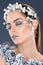 tender woman with hair accessory christmas pine cones winter makeup and glitter