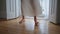 Tender woman legs stepping at morning home closeup. Unknown girl moving at floor