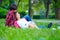 Tender young couple relaxing on spring meadow