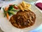 Tenderloin Meat with Demi Glace Sauce, Mushrooms, Potatoes and Boiled Fresh Vegetables at Restaurant