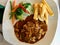 Tenderloin Meat with Demi Glace Sauce, Mushrooms, Potatoes and Boiled Fresh Vegetables at Restaurant