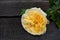 Tenderness yellow rose. Beautiful flower.  Rose on a gray wooden background