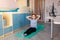 Tennage girl doing fitness gymnastics at home. Gymnastics exercises video tutorial. Children`s activity in quarantine during