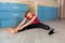 Tennage girl doing fitness gymnastics at home. Gymnastics exercises video tutorial. Children`s activity in quarantine during