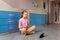 Tennage girl doing fitness gymnastics at home. Gymnastics exercises video tutorial. Children`s activity in quarantine during