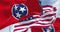 The Tennessee state flag waving along with the national flag of the US