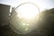 Tennis badminton racket under rays of sun glare bloom