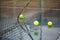 Tennis ball bouncing on court covered with rain