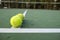 Tennis ball on green court