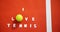 Tennis ball with I love tennis text in court 4k