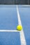 Tennis ball indoor on tennis court, white line