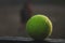 tennis ball lying on a metal stand