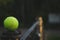 tennis ball lying on a metal stand