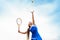 Tennis ball serving. Correct stance and practiced movements are essential for a good shot. A talented tennis player woman has been