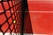 A tennis ball on the textured floor of a red court near the net after losing a match point