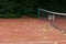 Tennis balls scattered on clay tennis court. Outdoor sports ground. Training. Selective focus, copy space. Design element