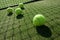 Tennis balls on tennis grass court.