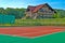 Tennis court, a beautiful chalet in the back and surrounded by trees and hills