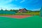 Tennis court, a beautiful chalet in the back and surrounded by trees and hills
