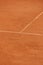 tennis court made of red clay or soil with markings for game or competition. sports and recreation