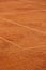 tennis court made of red clay or soil with markings for game or competition. sports and recreation