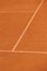 tennis court made of red clay or soil with markings for game or competition. sports and recreation