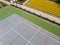 Tennis court and seats on the stadium stand aerial view