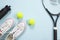 Tennis, Fitness, healthy lifestyle. Tennis ball, racket, shoes and fitness shaker isolated background. Top view