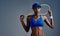 Tennis is a part of me. Studio shot of a sporty young woman posing with a tennis racket against a grey background.