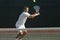 Tennis Player Hitting Backhand On Court