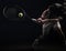 Tennis player is hitting tennis ball hard with Racket studio shot dark tone.