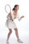 Tennis player holding racket and ball