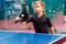 Tennis player plays the ball in table tennis, ping pong