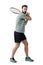 Tennis player waiting to hit ball holding racket with both hands in backhand pose