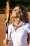 Tennis player woman sunbath with racquet net shadow on face