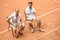 tennis players with vintage wooden rackets resting