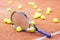 Tennis racket with many balls clay court