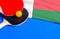Tennis rackets and ball with flag Madagascar on blue background, flag mockup. Table tennis competition concept
