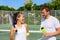 Tennis sport - couple relaxing after playing game