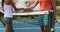 Tennis - tennis players shaking hands at net after tennis match at tennis court