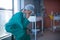 Tensed female surgeon sitting in ward