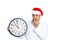 Tensed man in santa hat holding clock