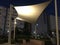 Tensile shade structure with MS pipe supports and heavy duty fabric at an park of an five star hotel