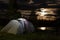 Tent against mountain at night