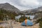Tent in beautiful spot overlooking mountain lake