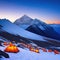 Tent camp and orange tents on the plateau of a mountain the point of acclimatization of climbers before a