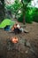 Tent camping couple romantic sitting by bonfire night